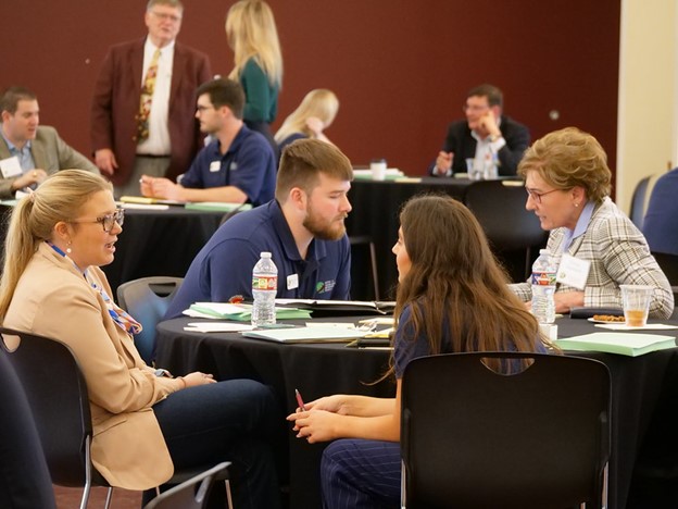 Students and mentors discuss business plans
