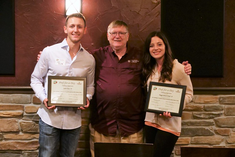 Professor Rister stands in the middle, with two former students on either side