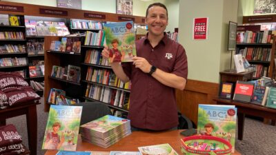 Author holding book