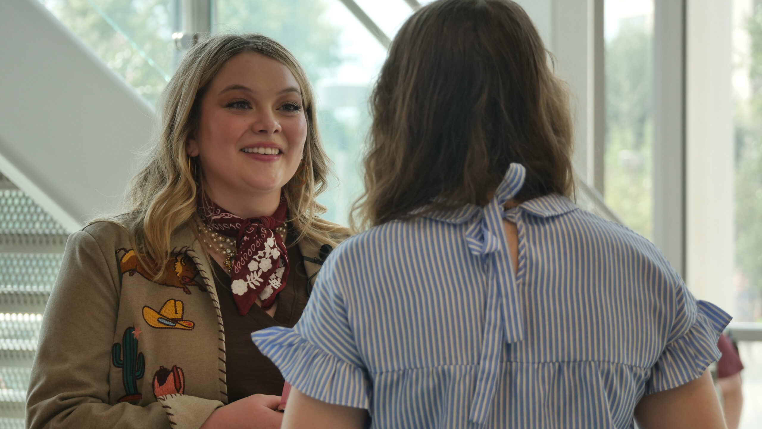 Maggie Terry speaking to a female student
